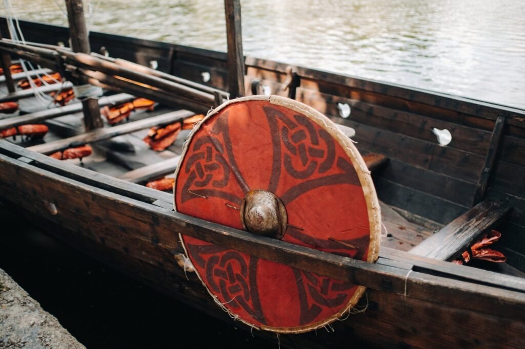 La cultura Vikinga an antique viking ship on the river. old boat